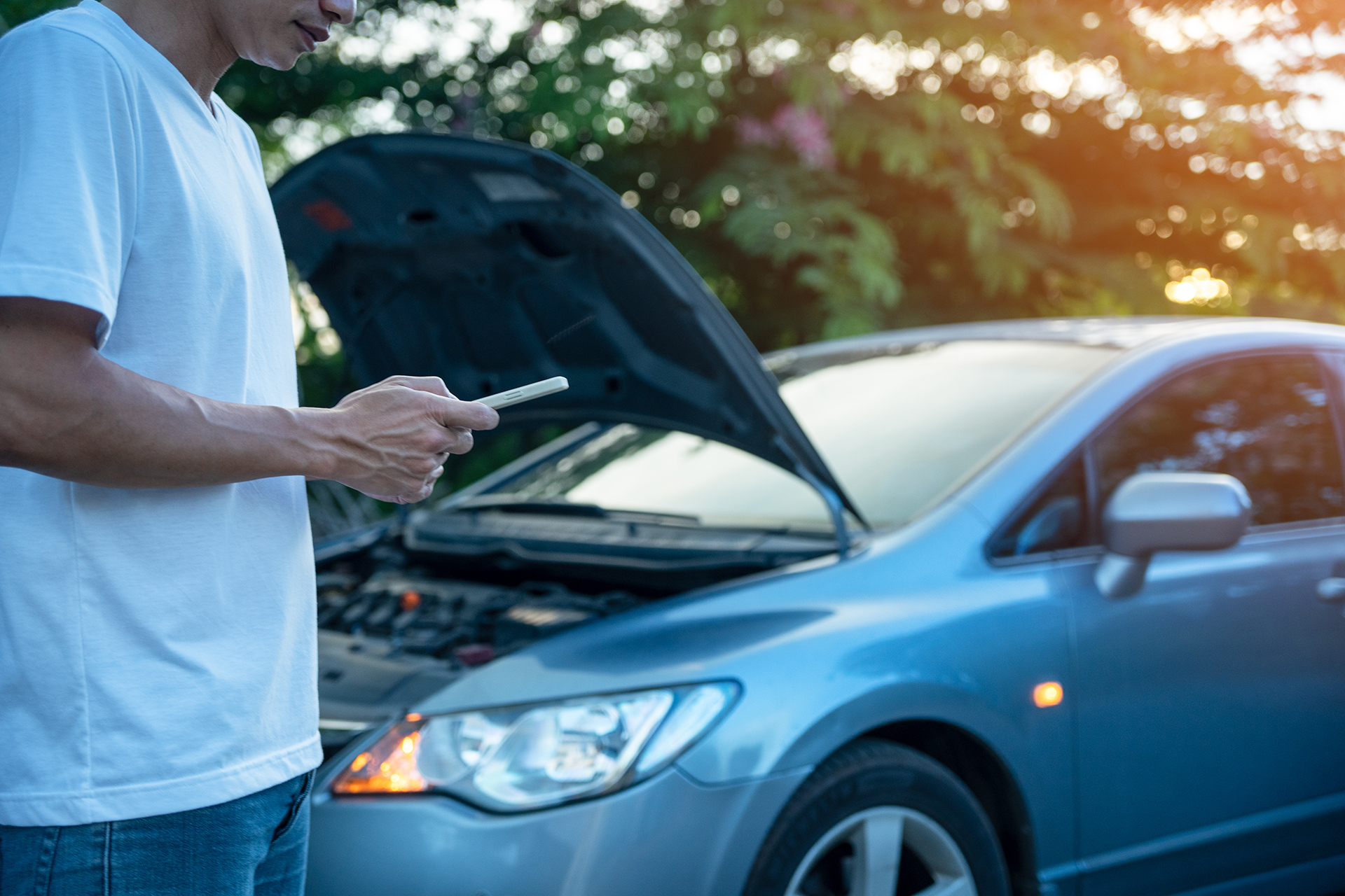 emergency safety. Man use phone to calls a mechanic because his